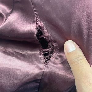 Rip on interior right sleeve.